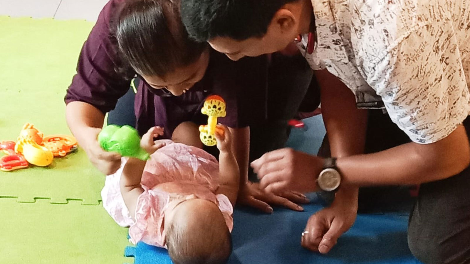 ADOPTION: Adoptive parents with baby from our child care centre