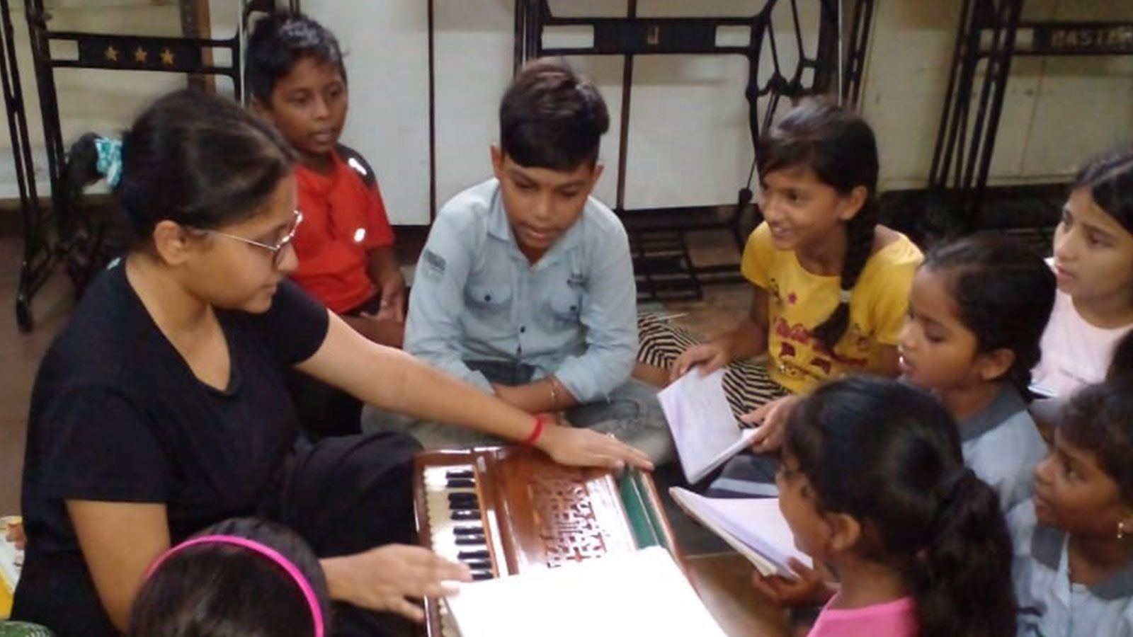 EDUCATION: Harmonium class at our Mahatma Gandhi Nagar Quarry community centre