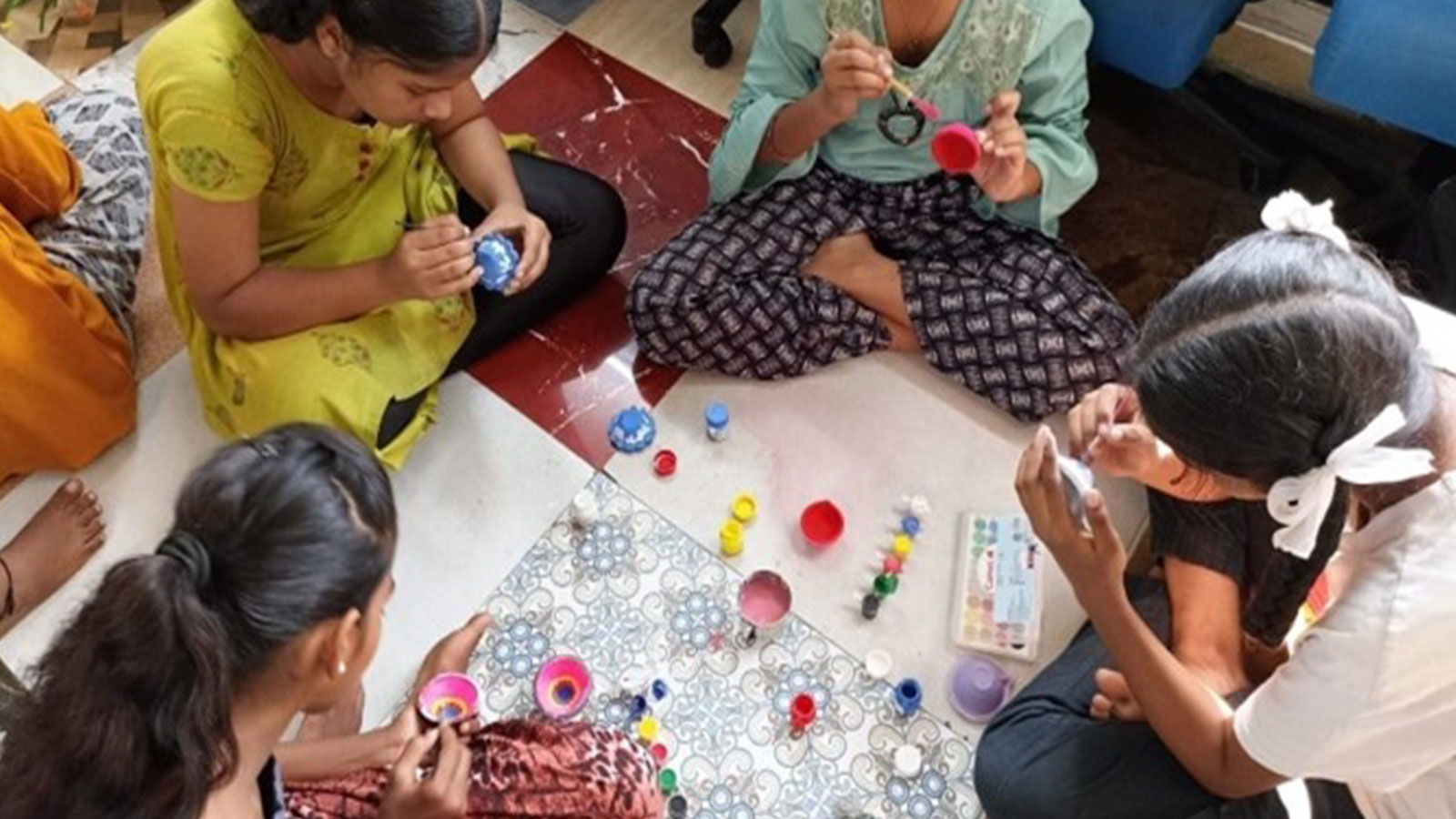 EDUCATION: Painting Diyas at our Mahatma Gandhi Nagar Quarry community centre